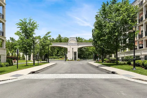 a view of a street with a building in the background