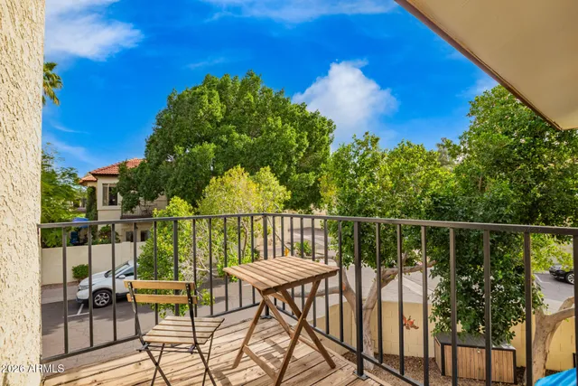 a view of a balcony with chairs