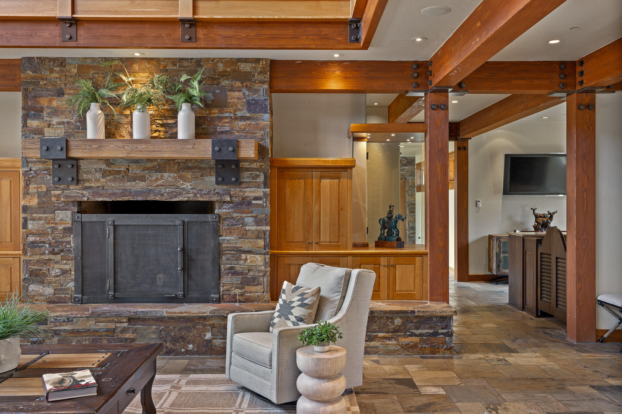 18883 Sutherland Court Bend, OR 97702 - Photo 8 of 70 From the stone fireplace to the custom wet bar, every detail invites relaxation and refined hospitality.