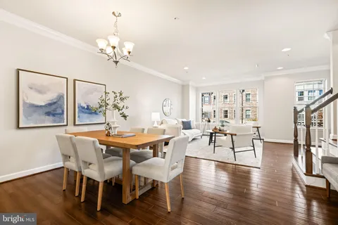 a living room with fireplace furniture and a window