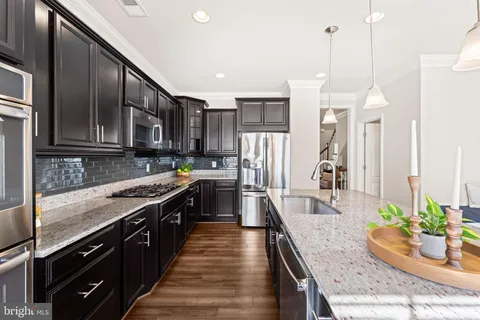 a bathroom with a sink toilet a mirror and shower