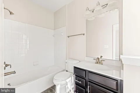 a picture of a bench in front of a wall