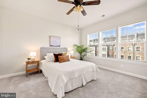 a living room with furniture fireplace and a window