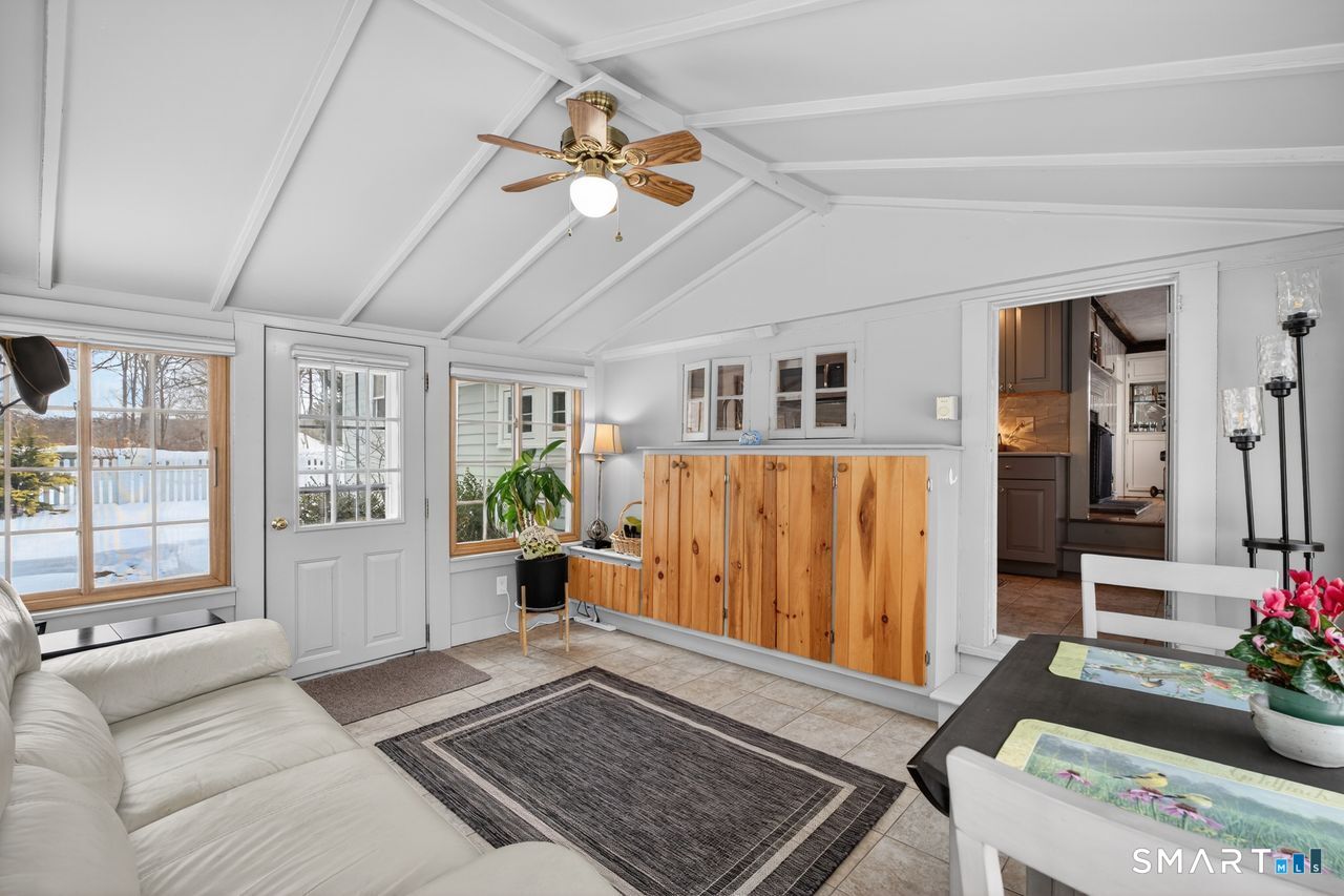 279 Roast Meat Hill Road Killingworth, CT 06419 - Photo 11 of 24 The sunroom nestled off the kitchen with access to the fenced bachyard.