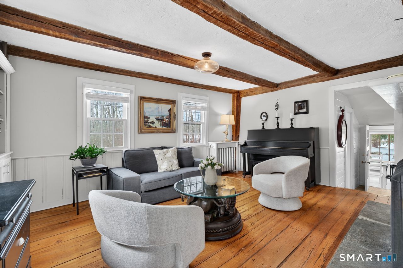 279 Roast Meat Hill Road Killingworth, CT 06419 - Photo 12 of 24 Beams and wood - burning fire place make the living area a treat to spend time in.