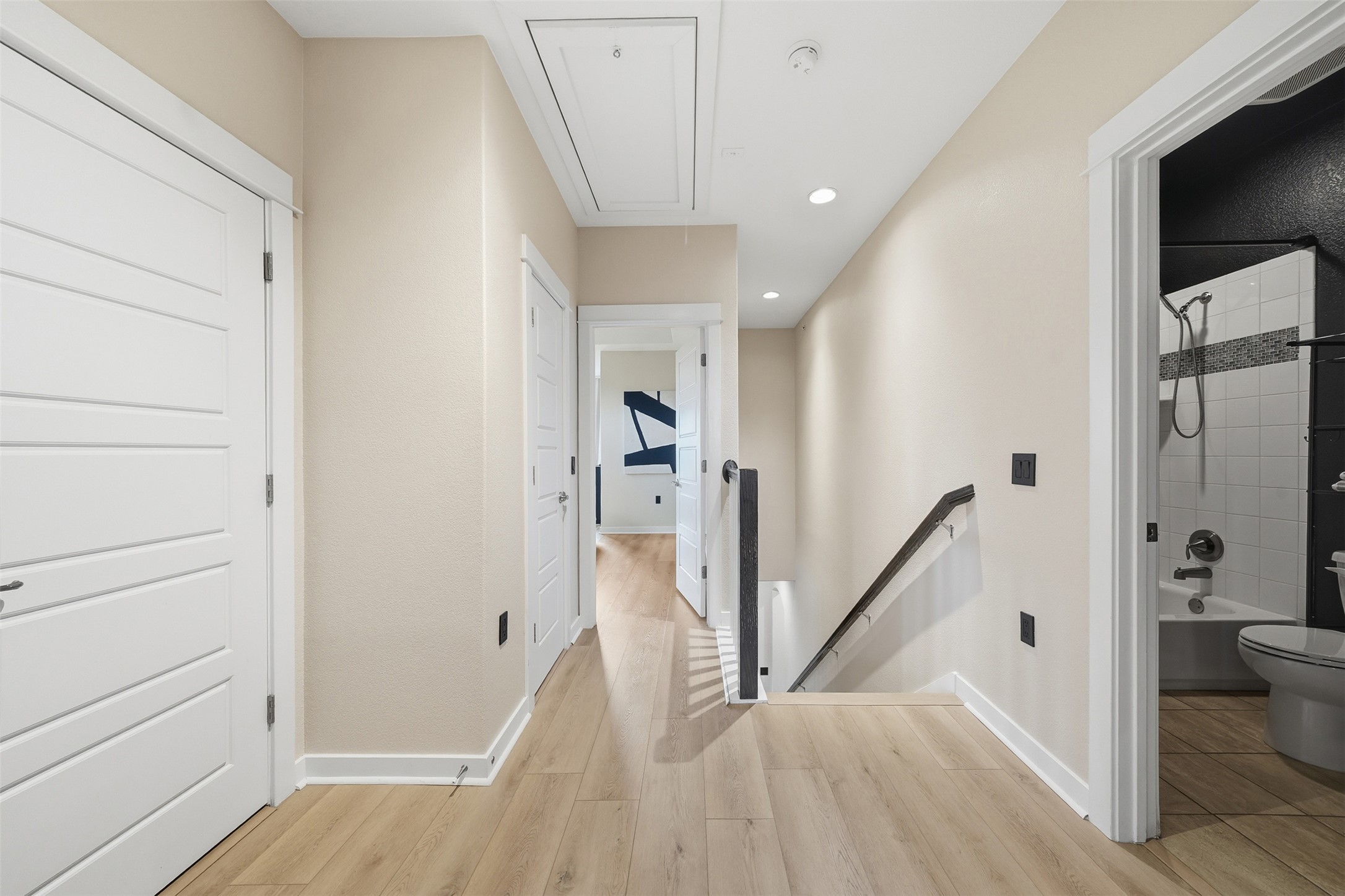 3901 Vaughan Street Austin, TX 78723 - Photo 17 of 37 Hallway featuring wood-finish flooring, recessed lighting, and white trim
