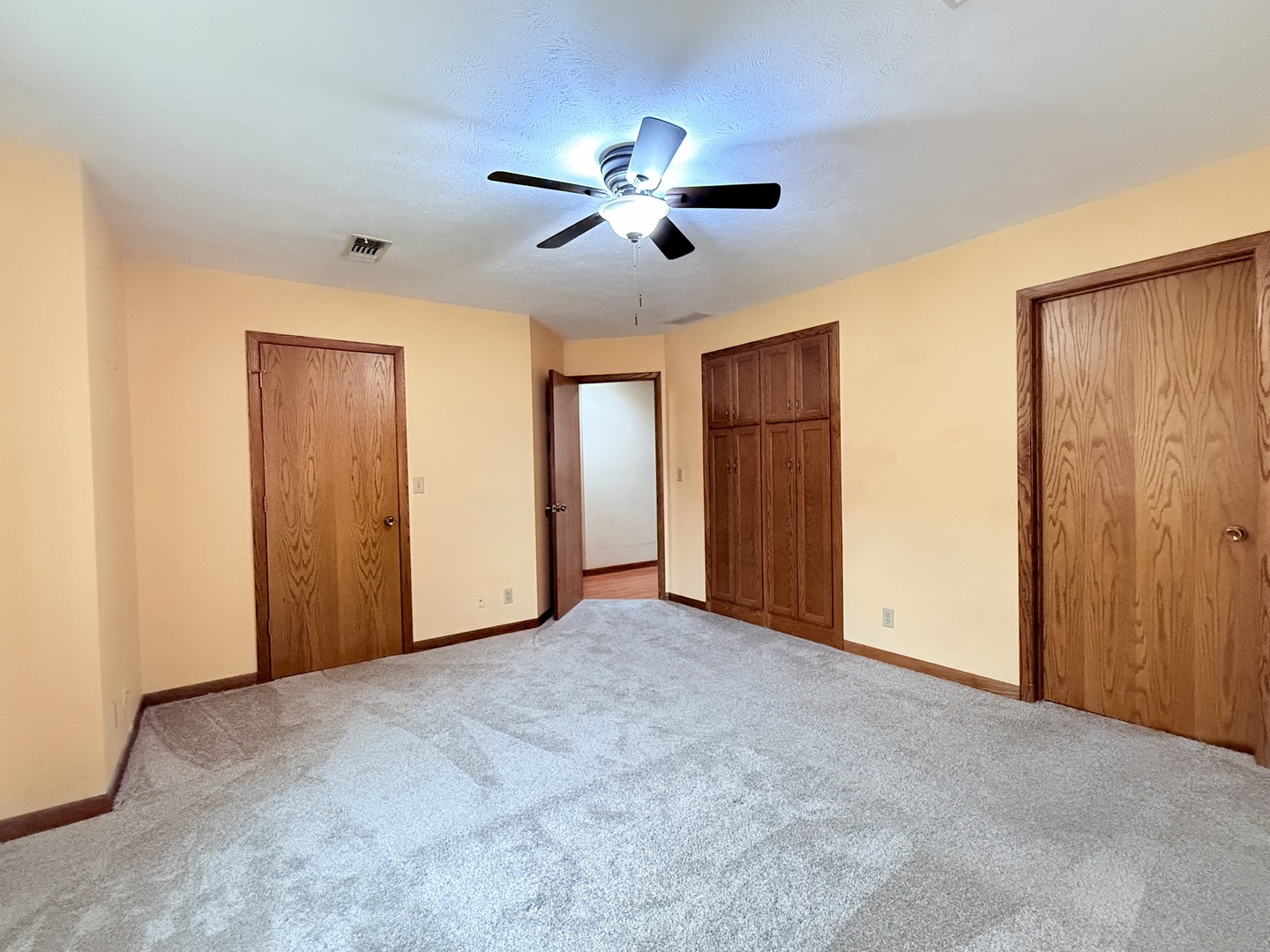 101 East 10th Street Gridley, IL 61744 - Photo 14 of 17 a view of empty room with ceiling fan