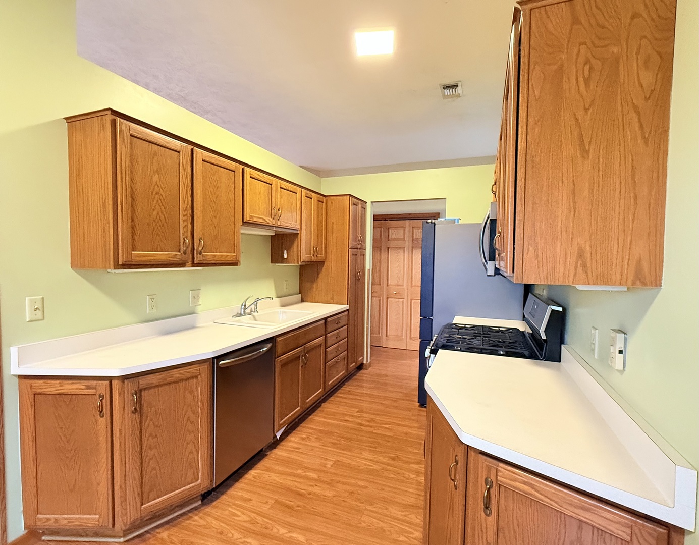 101 East 10th Street Gridley, IL 61744 - Photo 6 of 17 a kitchen with stainless steel appliances a sink and cabinets