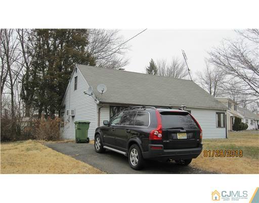 25 Caldwell Road Edison, NJ 08817 - Photo 1 of 14 a view of a car in front of house