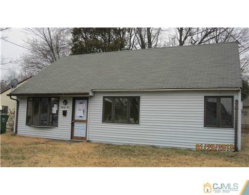 25 Caldwell Road Edison, NJ 08817 - Photo 2 of 14 a black and white photo of a house