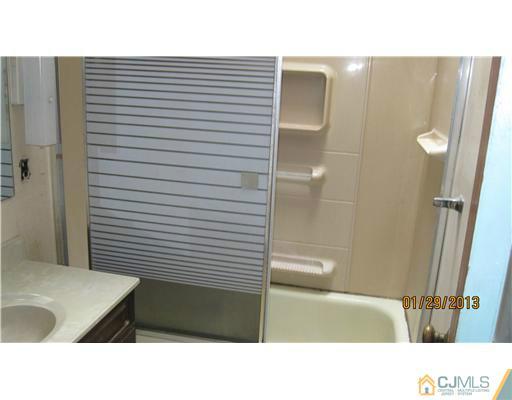 25 Caldwell Road Edison, NJ 08817 - Photo 13 of 14 a bathroom with a bathtub and shower