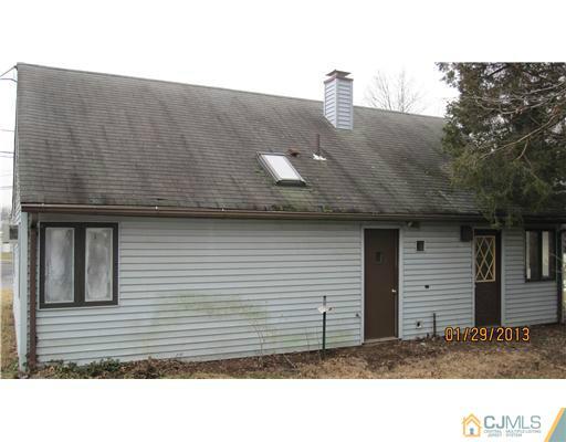 25 Caldwell Road Edison, NJ 08817 - Photo 3 of 14 a black and white photo of a house