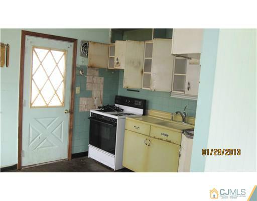 25 Caldwell Road Edison, NJ 08817 - Photo 7 of 14 a kitchen with a stove a sink and a microwave