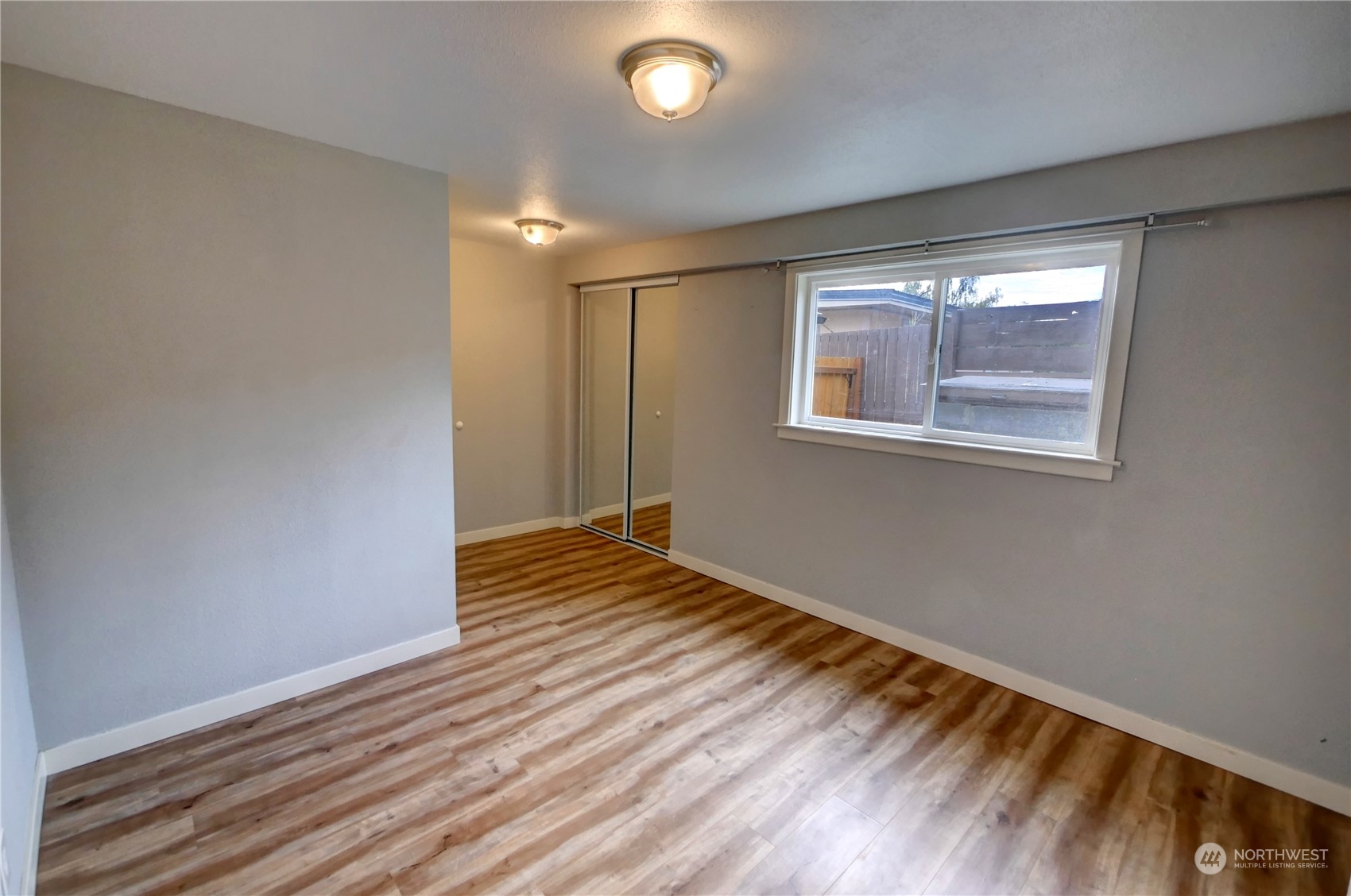 26 Middle Lane Road Omak, WA 98841 - Photo 30 of 38 a view of an empty room with wooden floor and a window