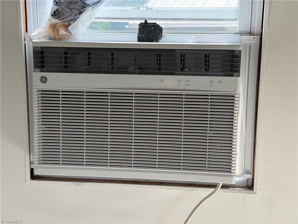 5264 Hopkins Road Browns Summit, NC 27214 - Photo 41 of 42 New AC unit in the workshop