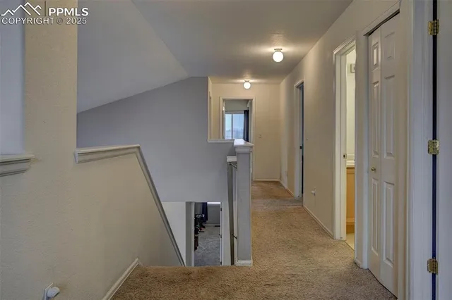 a view of hallway with stairs