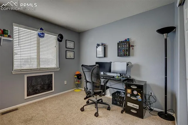 a workspace with furniture and a window