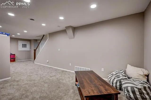 a bathroom with a sink toilet vanity and shower