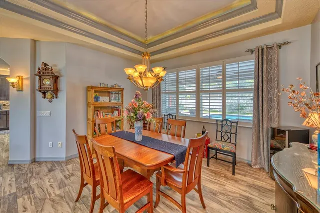a dining room with furniture and window