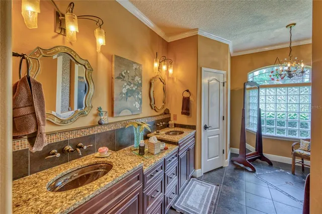 a bathroom with a sink mirror and a bathtub