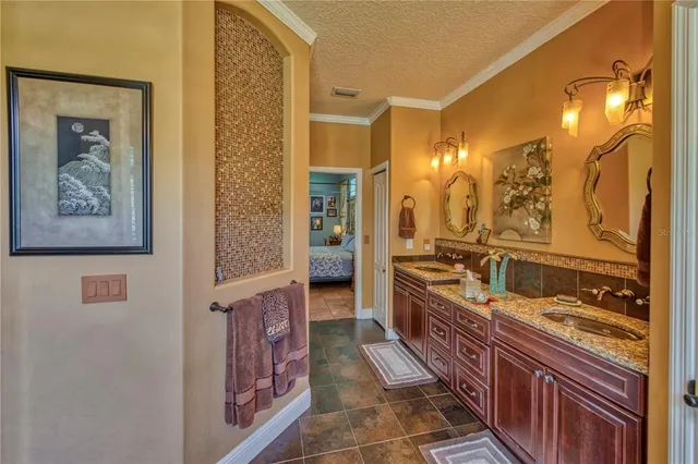 a bathroom with a double vanity sink and a mirror