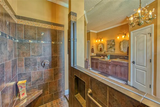 a bathroom with a glass shower door and a bathtub
