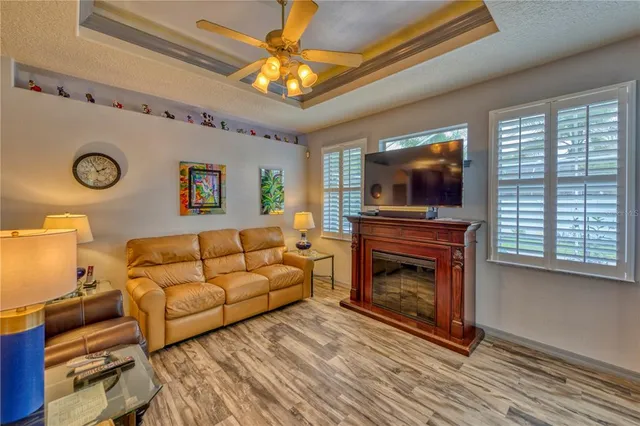 a living room with furniture and a chandelier
