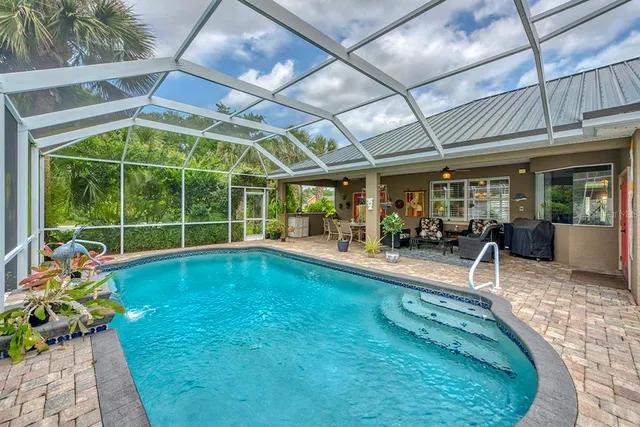 a view of swimming pool with outdoor seating