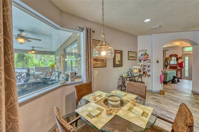 a workspace with furniture window and wooden floor
