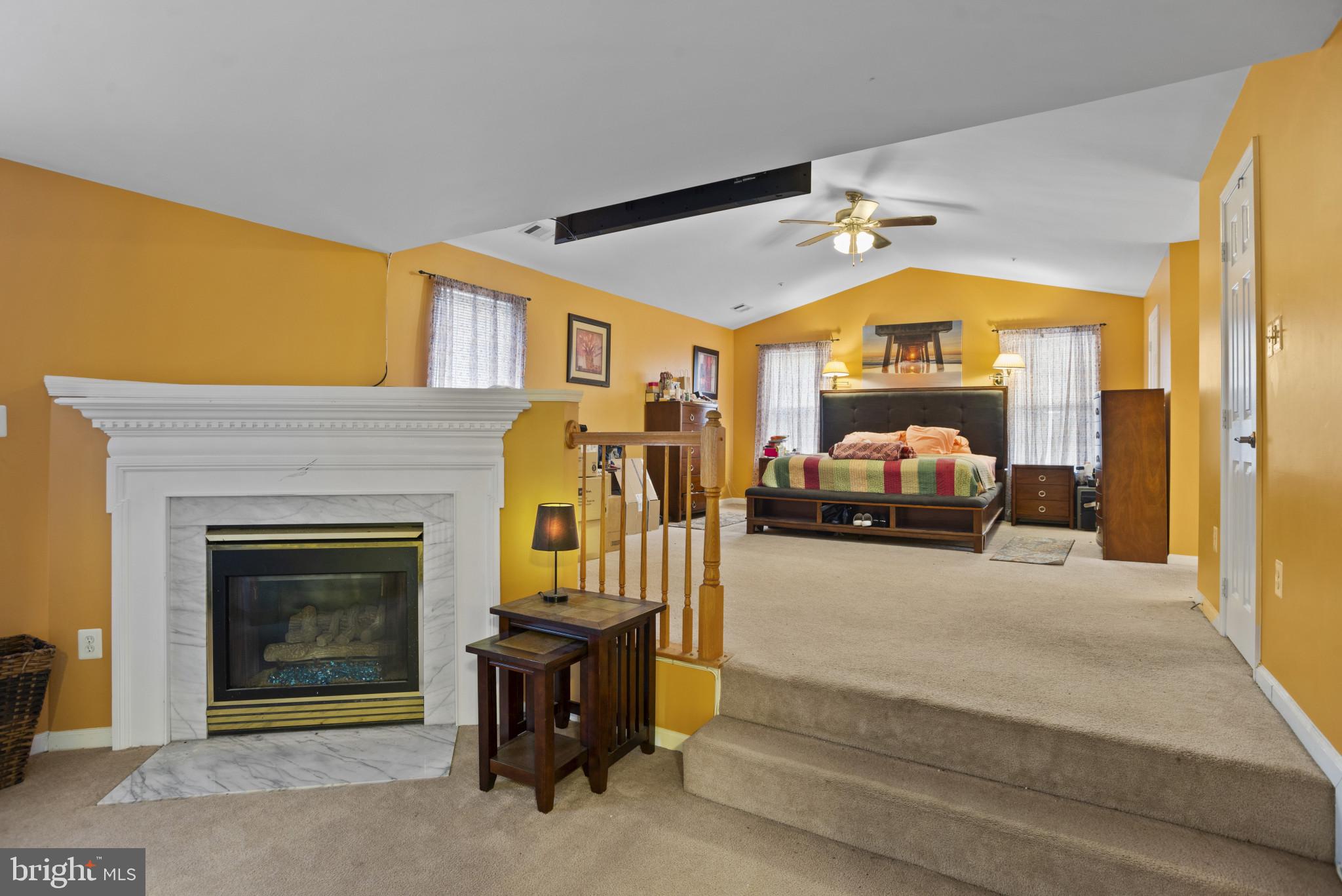 500 Treehouse Court Fort Washington, MD 20744 - Photo 14 of 25 a living room with furniture and a fireplace