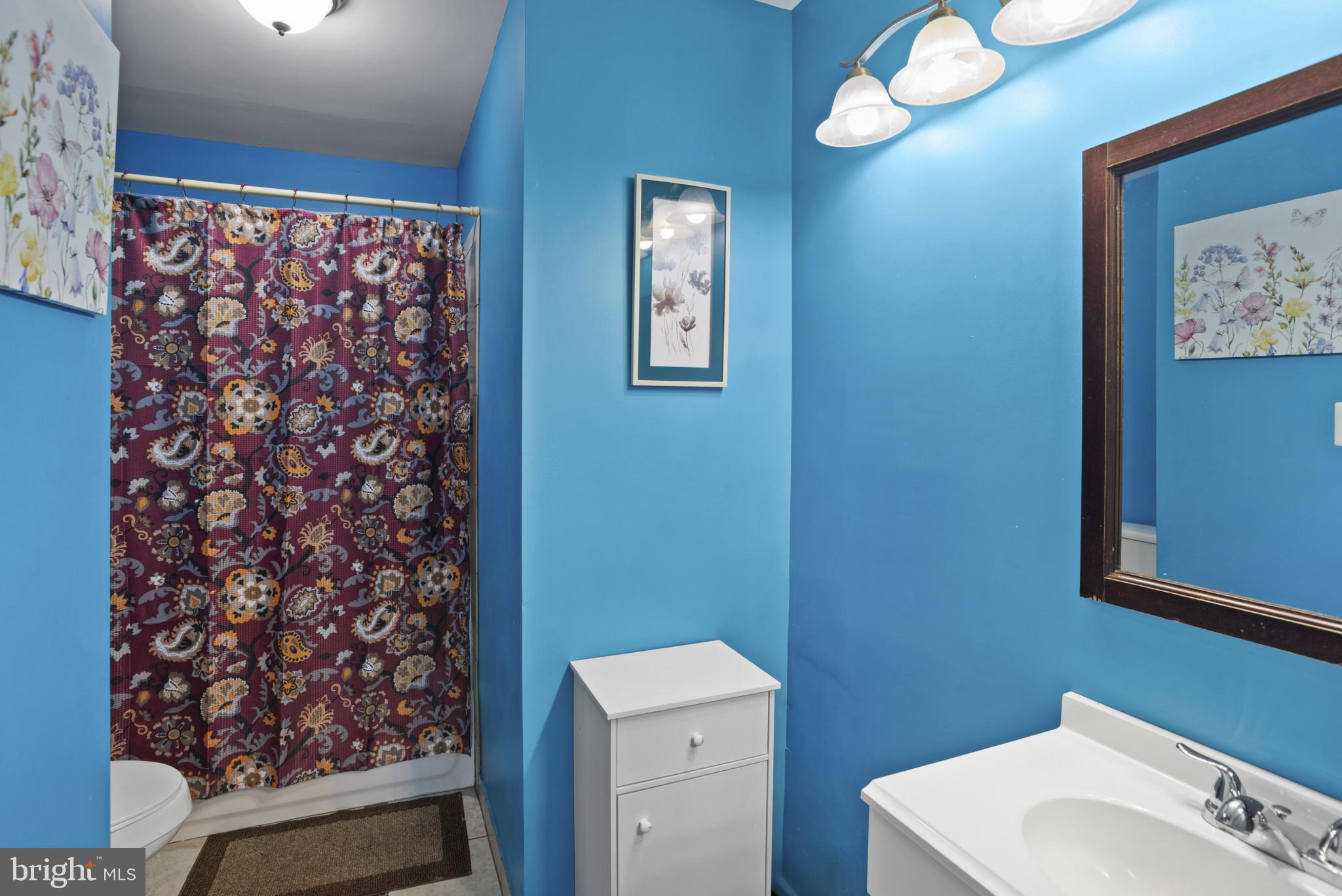 500 Treehouse Court Fort Washington, MD 20744 - Photo 20 of 25 a bathroom with a toilet and a sink