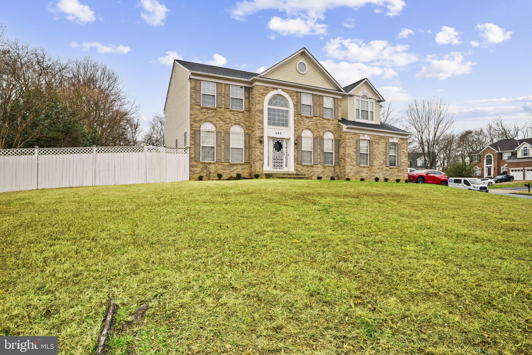 500 Treehouse Court Fort Washington, MD 20744 - Photo 2 of 25 a view of a big house with a big yard and large trees