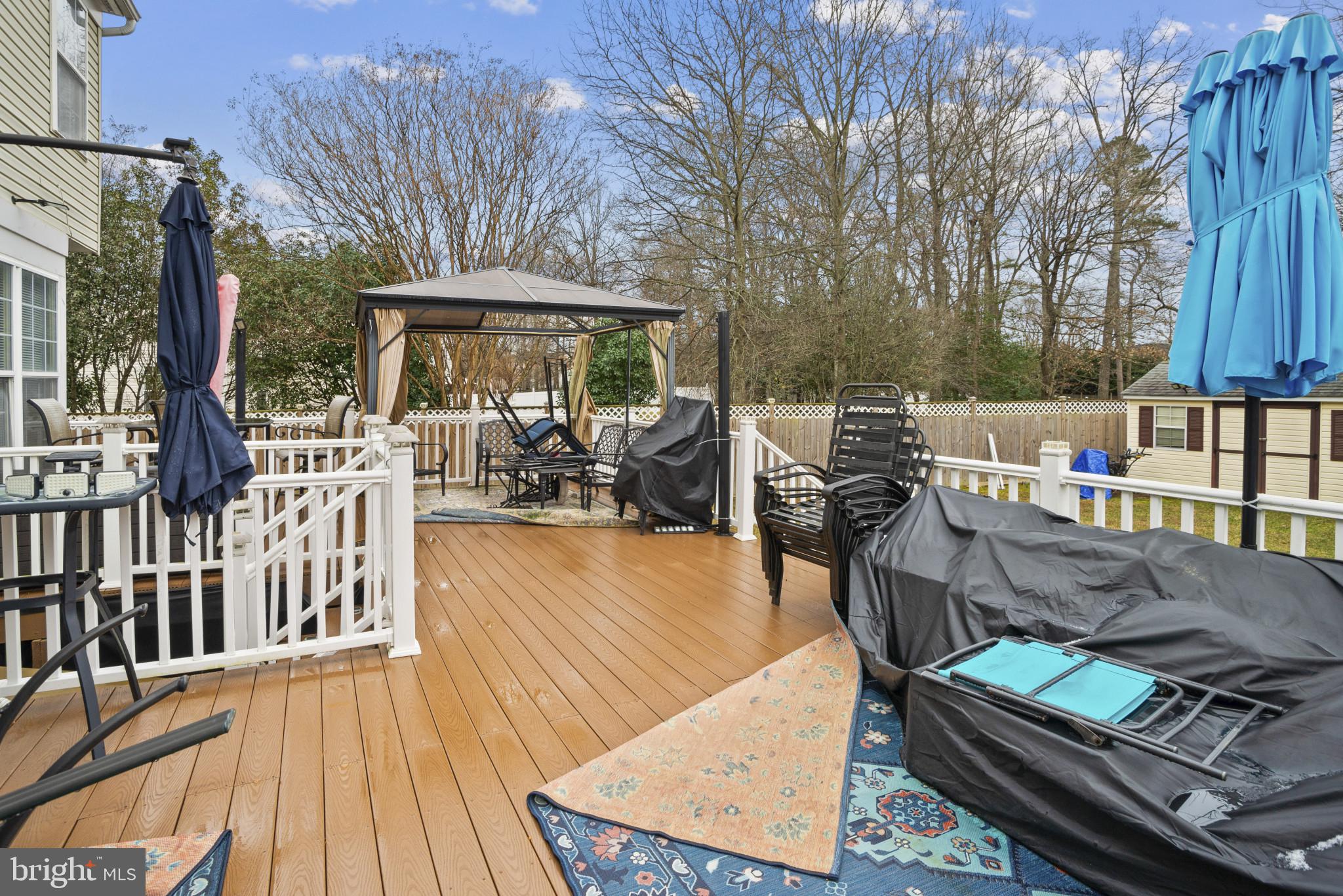 500 Treehouse Court Fort Washington, MD 20744 - Photo 21 of 25 a view of a patio with table and chairs wooden floor and fence