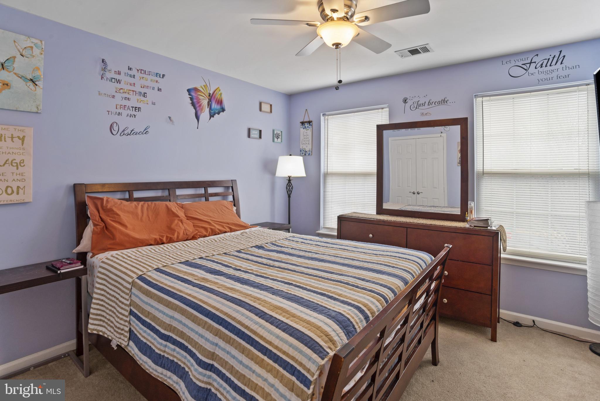 500 Treehouse Court Fort Washington, MD 20744 - Photo 22 of 25 a bedroom with a bed and a chandelier
