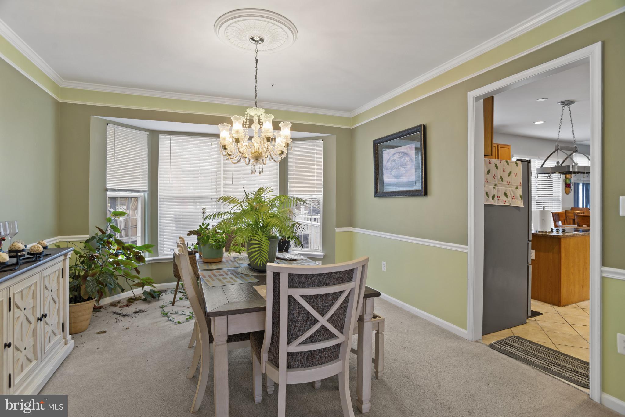 500 Treehouse Court Fort Washington, MD 20744 - Photo 8 of 25 a dining room with furniture and chandelier