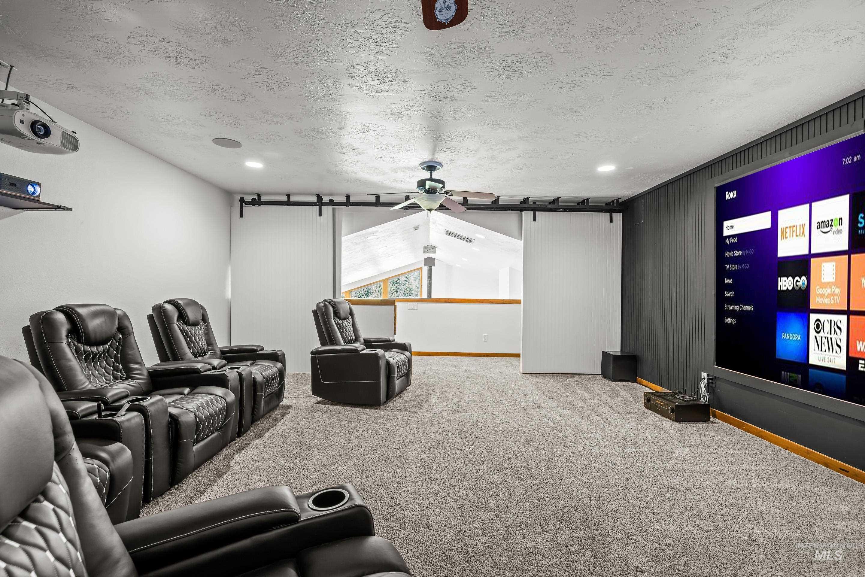 92 Cruickshank Road Horseshoe Bend, ID 83629 - Photo 40 of 50 Dedicated media room featuring a large projection screen, recessed lighting, and a ceiling fan
