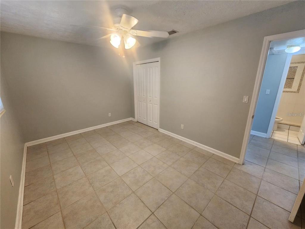 109 21st Street Northeast Bradenton, FL 34208 - Photo 6 of 14 en empty room with windows and entrance