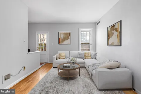 a living room with furniture and windows