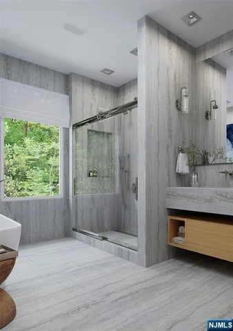 a spacious bathroom with a shower and a sink