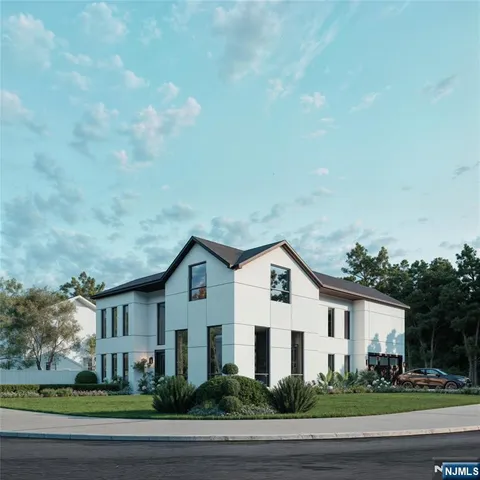 a view of a white house with a yard and plants
