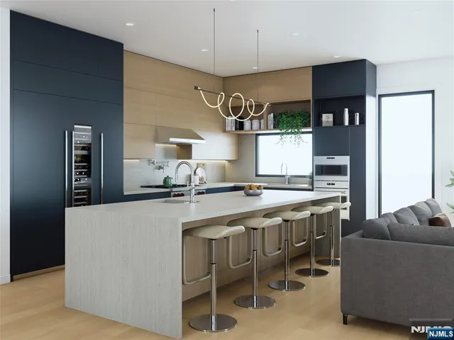 a large kitchen with a table and chairs in it