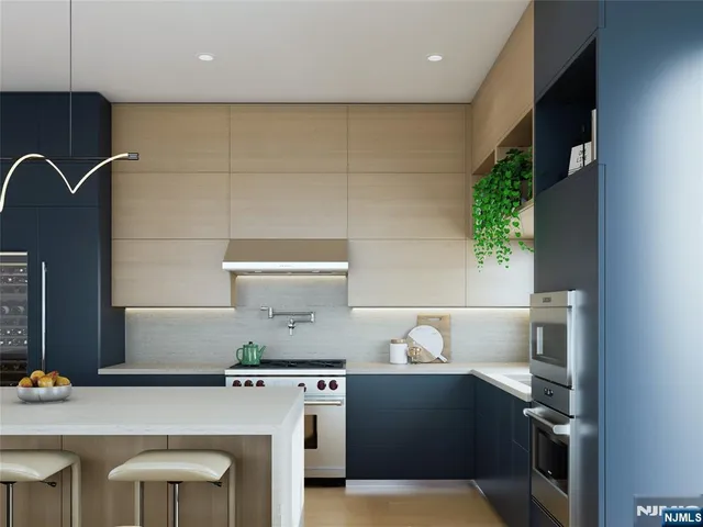 a kitchen with a sink appliances and cabinets