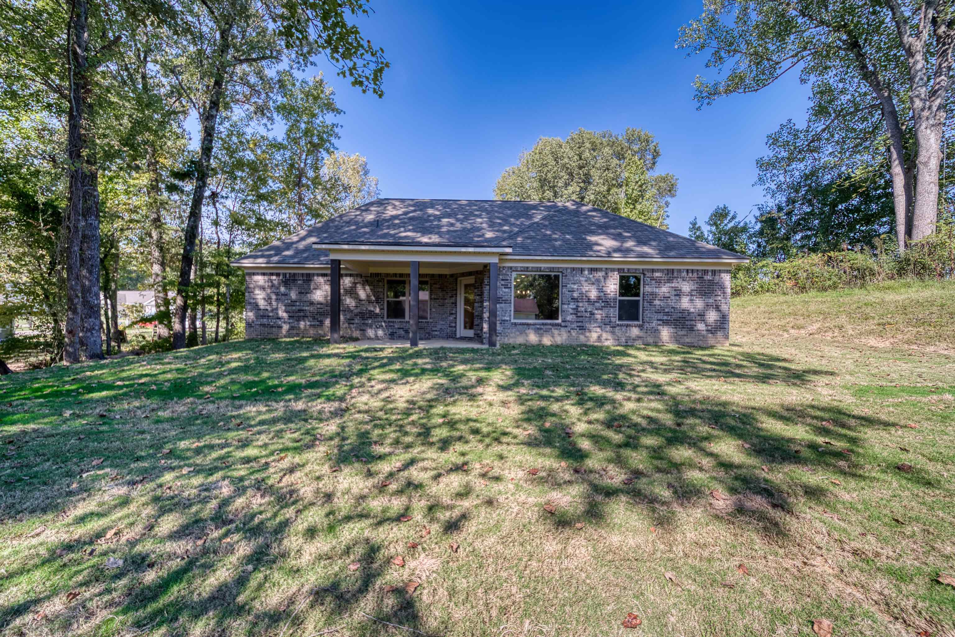 109 Walnut Ridge Ripley, TN 38063 - Photo 29 of 39 a front view of a house with a garden