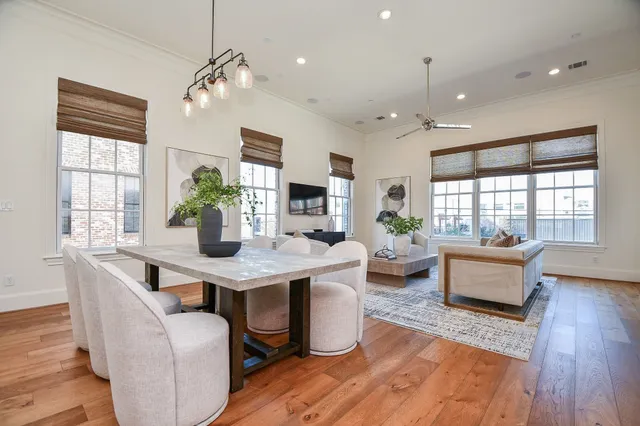 a view of a dining room with furniture window and wooden floor