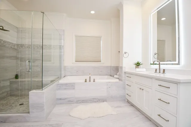 a bathroom with a bathtub and a sink