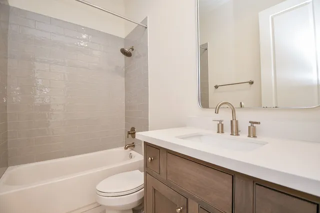 a bathroom with a sink a toilet and a bathtub