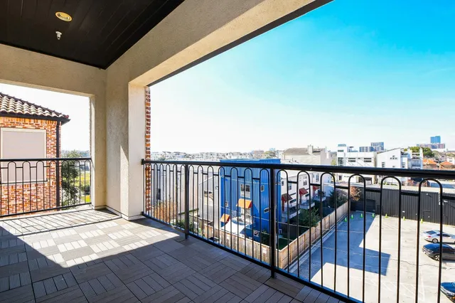 a view of balcony with wooden floor