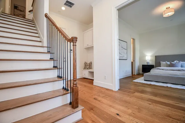 a large white bed in a white room