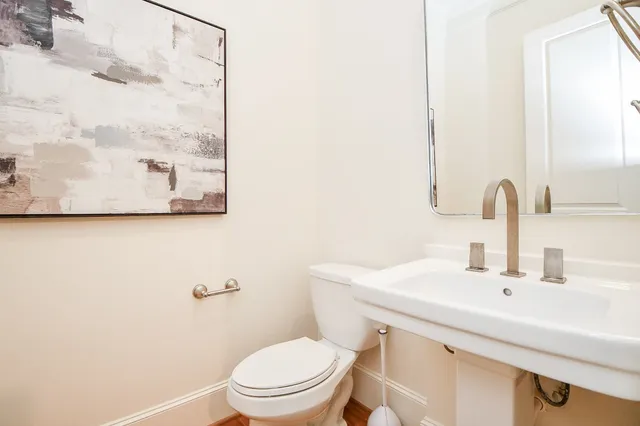 a view of living room with kitchen island furniture and a wooden floor