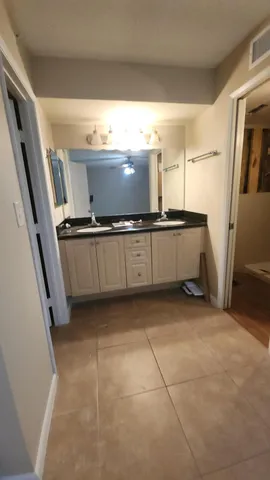 a bathroom with a bathtub and shower